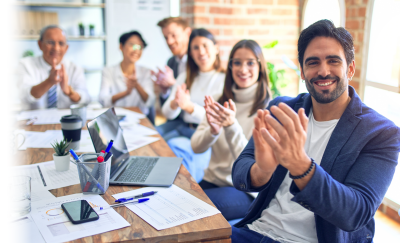 Photo: Group applauding the ability to earn CEU, CPE and PDU professional credits by attending ONLC's classes.